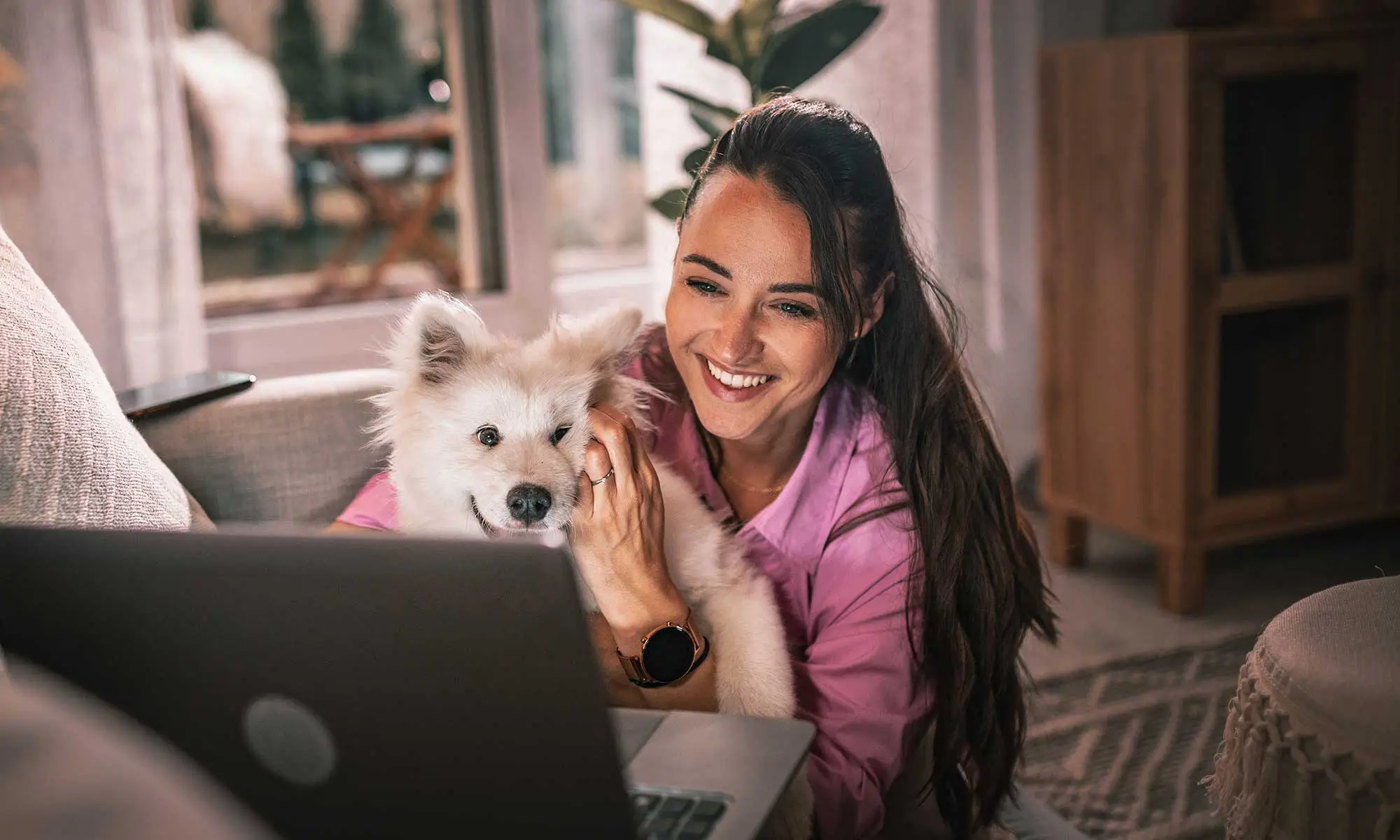 A woman with a dog making an appointment