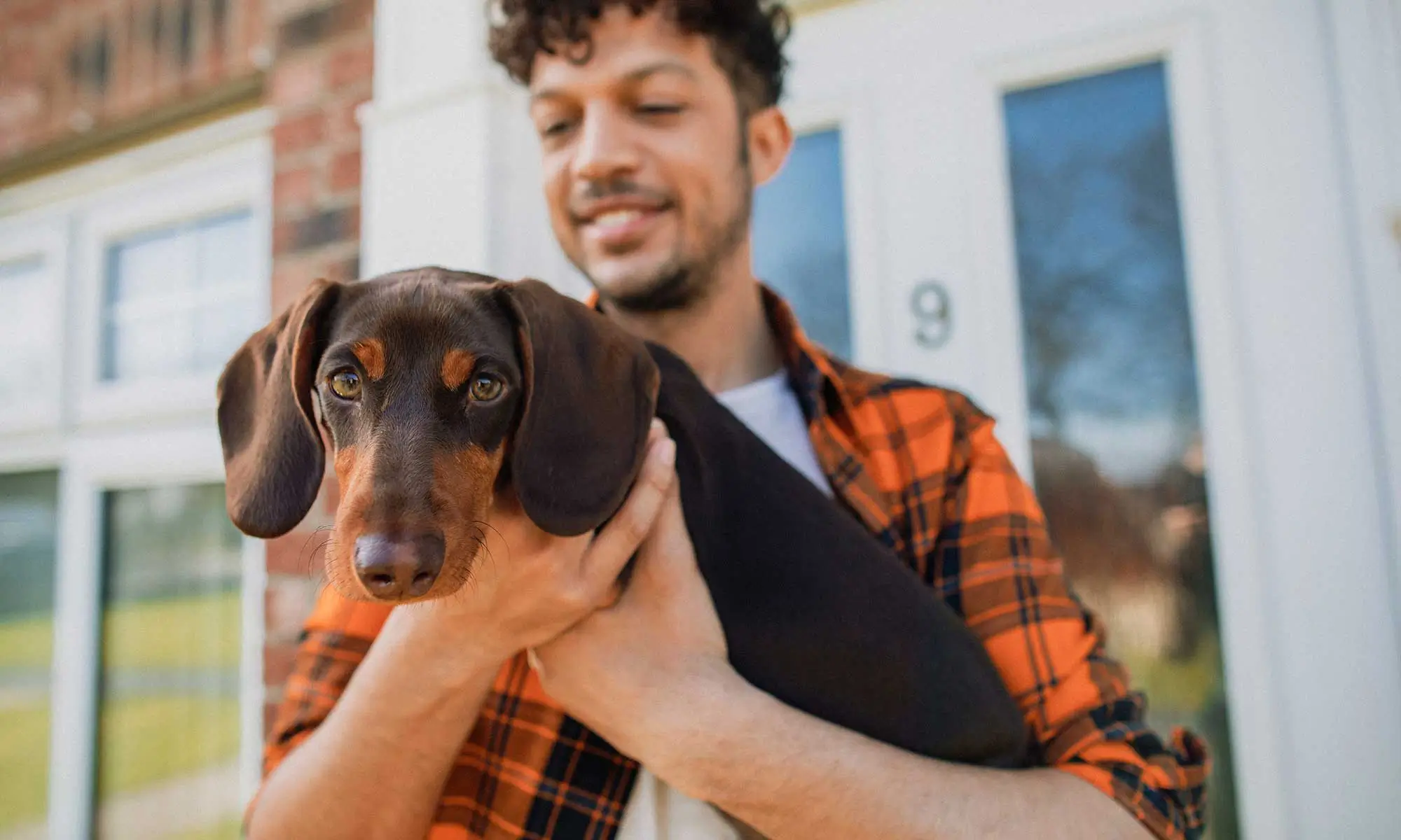 A man holding a dog